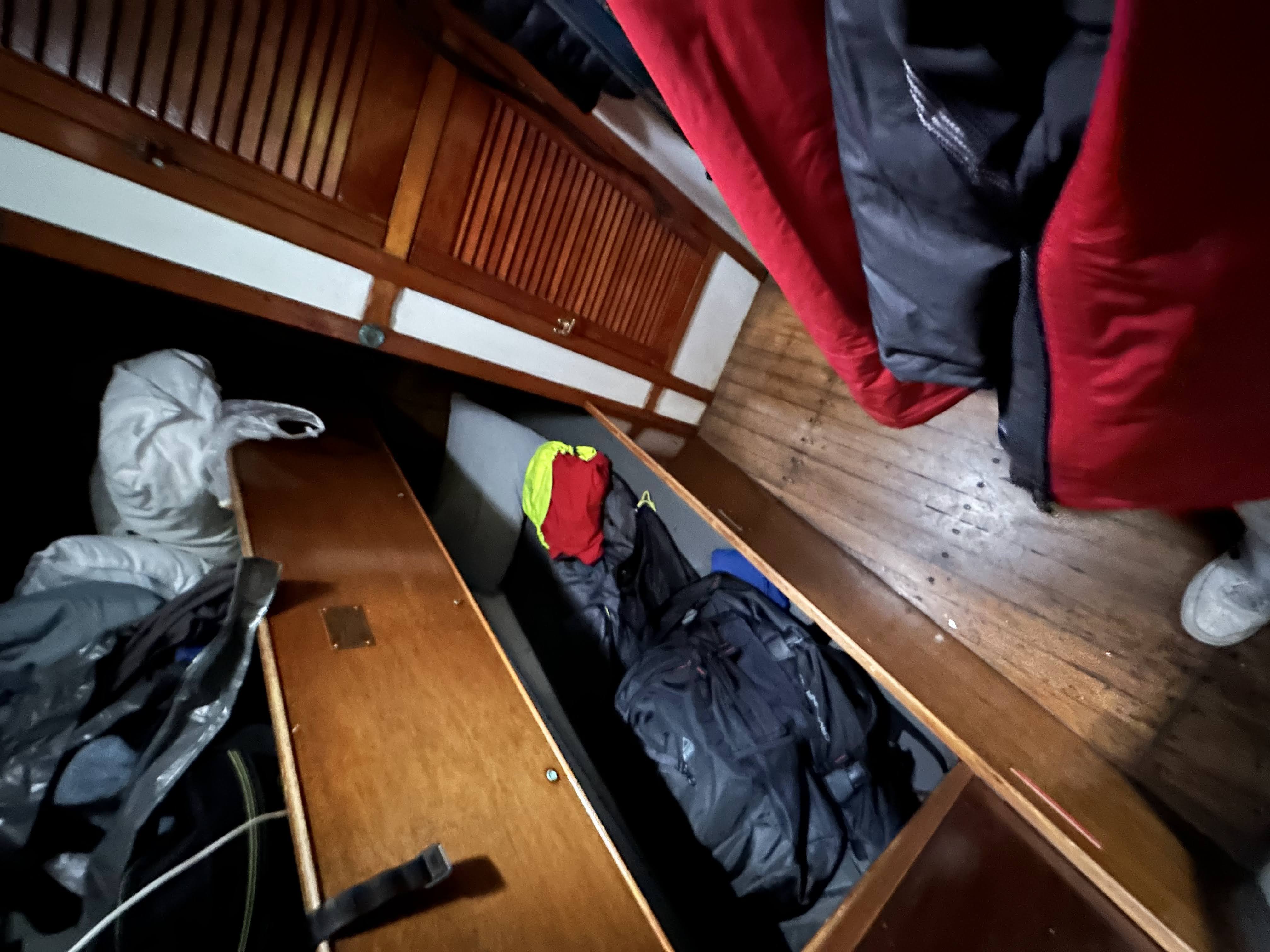 The wooden bunks and gear below deck