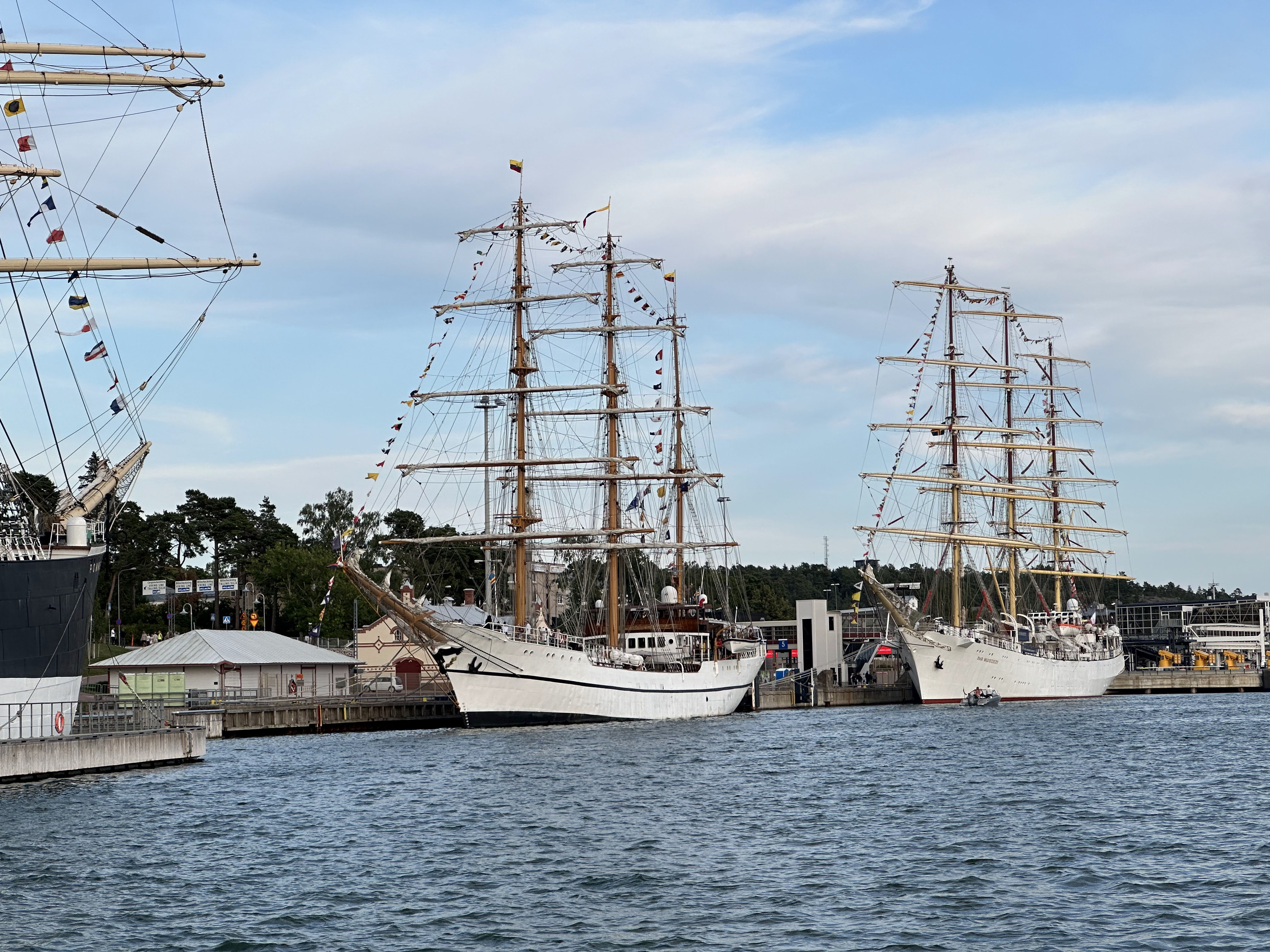 Tall ships lined up in Mariehamn harbor before the start